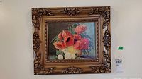 Frontal photo of framed floral print showing the full frame and artwork.