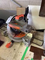 Overview of Terratek 10-inch miter saw showing main body, blade guard, handle, and base.