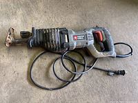 Side view of Porter Cable reciprocating saw showing general condition and power cord.