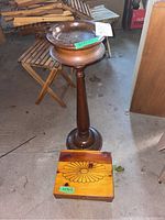 Full view of wooden standing ashtray and wood box with floral decoration.