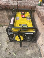 Front-left angle view showing yellow tank, black frame, handle, and wheel