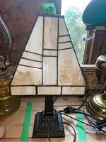 Full view of resin shade lamp showing geometric trapezoidal shade and dark detailed base