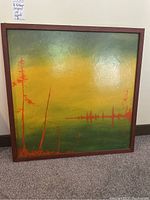 Full view of framed painting showing gradient background and tree silhouettes