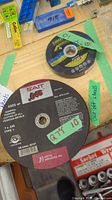 Photo showing both SAIT and SHOP PRO cutting wheels together, highlighting different sizes and labels