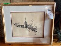 Framed pen drawing depicting church and buildings on a hill with sun, signed by artist