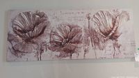 Full view of unframed floral print with three large flowers in muted tones.