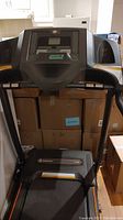 Front view of Horizon CT 50 treadmill showing the digital console, handrails, and running belt.