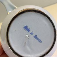 Bottom mark showing blue stamp 'Made in Sweden' on the cast iron enamel dish base.