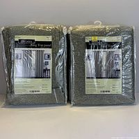 Two packaged curtain panels from Bronx brand, Aqua color, 52x96 inches, labeled Ring Top panel