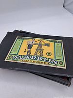 Closed kit box with vintage Marklin Metallbaukasten label featuring a man with a crane illustration