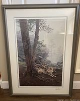 Framed signed limited edition print 'Guardians of the Den' by Daniel Smith, showing two wolves in a forest natural scene.