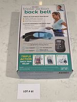 Boxed Dr Ho's Triple Action Back Belt with product image and information on front of box, showing product features and usage.