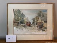 Framed watercolour painting showing streetcar on a track, buildings, and a horse-drawn carriage, signed by artist.
