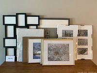 Group photo of all nine frames together showing various sizes and styles with some frames containing winter scenery photos featuring snow and trees.