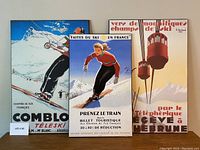 Three vintage ski poster reproductions on plaques displayed together. Shows overall look and size variation.