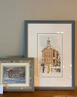 Two framed artworks: larger Walter Campbell signed and numbered print with winter scene and smaller decorative framed wall art with house in snow.