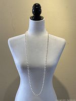 Necklace displayed on mannequin to show overall length and drape