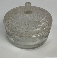 Closed box showing overall shape and floral pattern