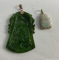 Both pendants displayed front side on white background