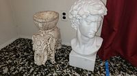Photo of white plaster Michelangelo's David bust and off-white elephant plant stand showing full view and condition details.