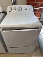 Front view of dryer with door closed, control panel and body visible