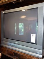 Front view of a 27 inch Panasonic CRT TV, showing the screen and lower control panel.