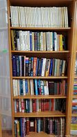 Books arranged on shelves, first image showing a full bookshelf with a mix of white hardcovers and assorted textbooks and novels