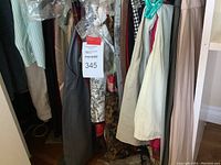 Rack of assorted small and medium women’s garments in solids and prints