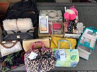 Photo showing overview of purses, bags, jewelry box, phone cases, pens, and hair accessories