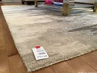 Close-up of rug corner showing texture and lot tag