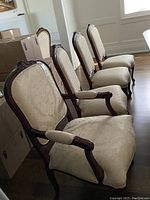Four chairs lined up showing captain’s chair at front, three side chairs behind