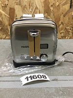 Front view of Holife 2-slice toaster showing digital controls, knob, and function buttons