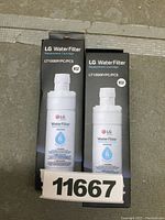 Two boxed LG water filter replacement cartridges showing front packaging with LG branding and model LT1000P.