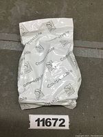 Front of the sealed white bag labeled 'Compostable' with certification logos.