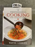 Front cover of the cookbook showing the title, author, and a bowl of soup with a ladle pouring soup.