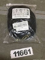 Black rope packaged in a sealed clear plastic bag with barcodes and labeling.
