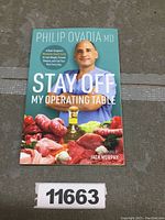 Front cover of the book 'Stay Off My Operating Table' showing author Philip Ovadia MD and food imagery.