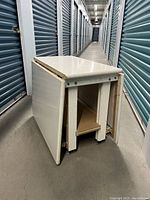 Table in collapsed state with both side panels folded down