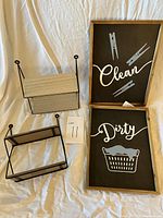 Set of two rectangular laundry signs and two small wooden and metal wall shelves on fabric background.
