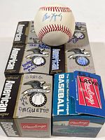 Six Rawlings American League baseballs with individual autograph boxes. Box tops display handwritten player names and some include dates.