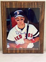 Full view of the signed photo mounted on wood plaque showing Phil Plantier holding a bat in Red Sox uniform.