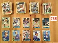 Several stacks of 1986 Topps baseball cards showing front of cards with player images and team logos.