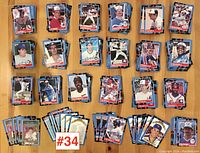 Top view of multiple stacks of 1987 Donruss baseball cards laid out on a surface showing a variety of players and teams.