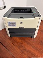 Front view of HP LaserJet 1320n printer showing overall exterior condition, color, and controls.