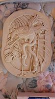 Carved flamingo wall plaque beige color with tropical leaves