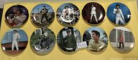 10 collector plates arranged in two rows of five, showing various Elvis Presley images