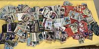 Photo showing large spread of baseball cards sorted in stacks of various sizes with notable player images.