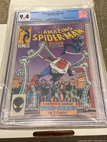Front view of Amazing Spider-Man #263 comic in CGC graded case showing 9.4 grade and cover artwork