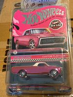 Full view of the Hot Wheels Custom Fleet Side die-cast car in unopened packaging clearly showing the pink car and Red Line Club branding