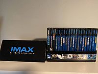 Front and side view of the IMAX Ultimate Collection box containing 20 DVDs revealing the IMAX branding and title on the box.